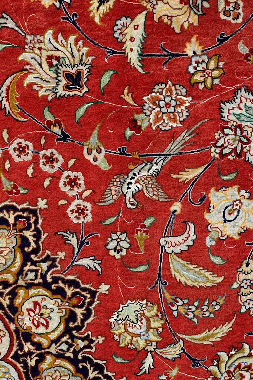 A carpet, Täbriz part silk, 341 x 248 cm.
