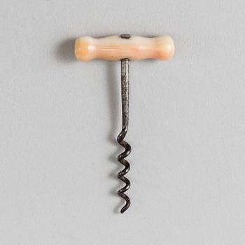 A 19th century bone and steel miniature corkscrew.