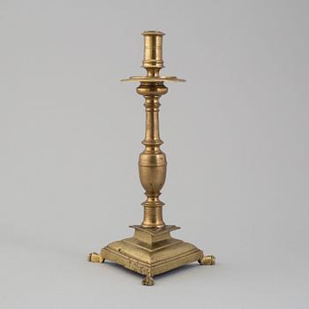 A 17th century bronze candlestick.