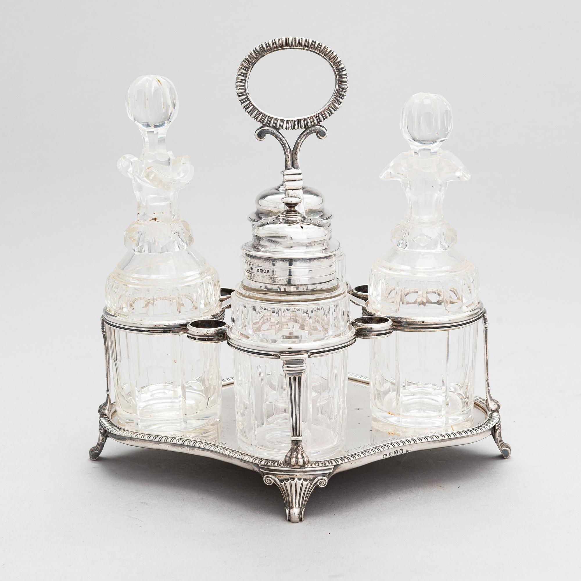 Glass and sterling silver cruet stand, maker's marks of Samuel Hennell and Robert Hennell III, London 1811 and 1879.