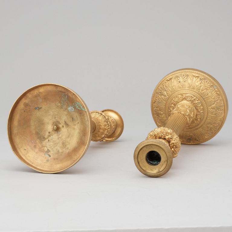 A pair of French Empire early 19th century candlesticks.