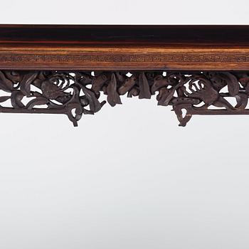 A massive zitan recessed-leg long table 'Jiaotousun Qiotouan', Qing dynasty, 19th century.