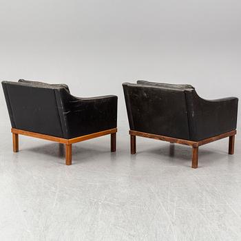 A pair of "The President" black leather armchairs by Ingemar Thillmark for OPE-möbler, Sweden.