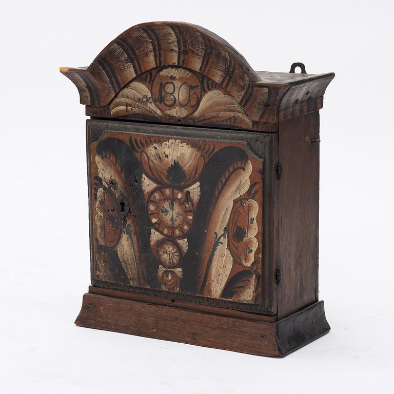 A Swedish wall cabinet, dated 1803.