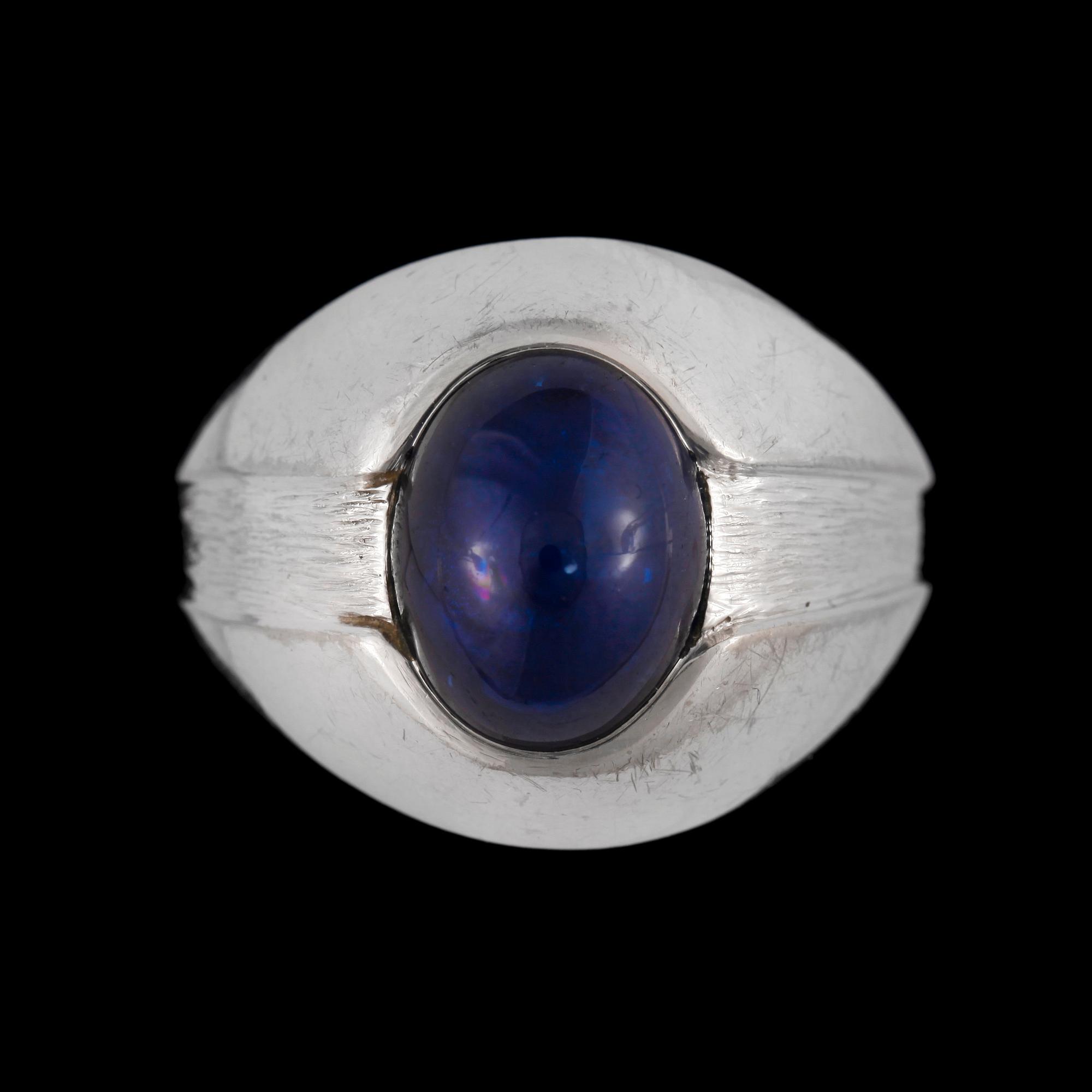 A cabochon cut sapphire ring.