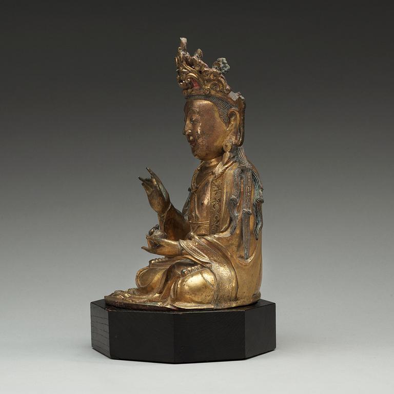 A  gilt-bronze figure of a seated Guanyin, Ming dynasty (1368-1644).