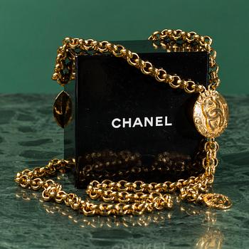 A belt by CHANEL.