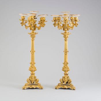 A pair of early 20th century bronze candelabras.