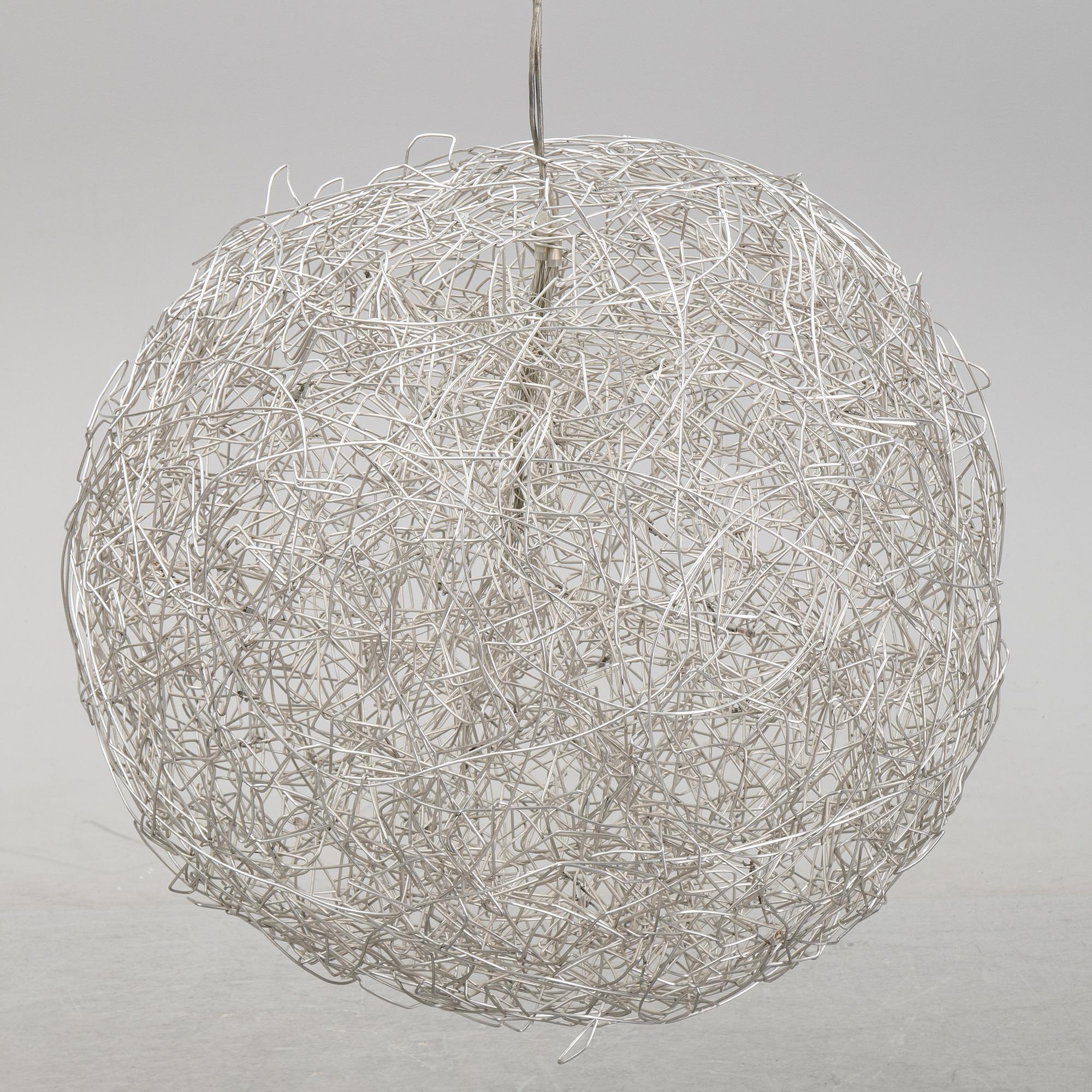 A 'Fil de Fer Ovale' ceiling light by Enzo Cattelini.