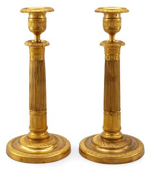 41. A PAIR OF EMPIRE CANDLESTICKS.