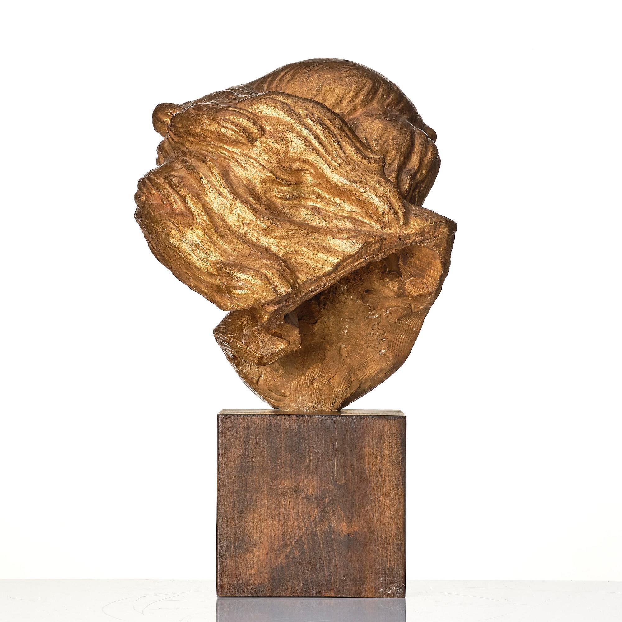 John Lundqvist, a gilt plaster sculpture of a young woman's head, dated 1933.