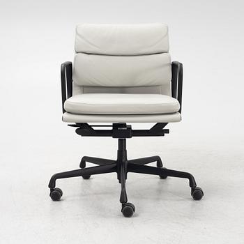 Charles & Ray Eames, a leather upholstered EA 217 soft pad office chair from VItra.