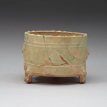 A green glazed tripod censer, Han dynasty (206 BC - 220 AD).