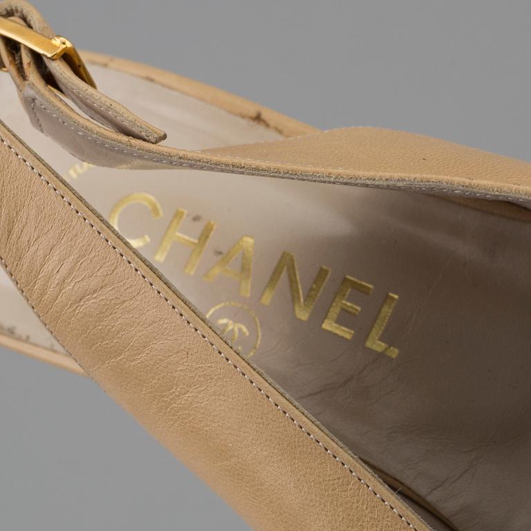 Beige leather slingbacks by Chanel.