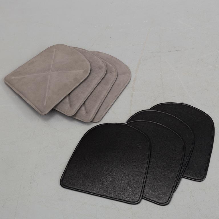 A set of four Tolix chairs.