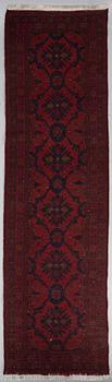 An Afghan runner, ca. 295 x 82 cm.