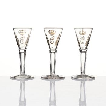 A set of six glasses and a bottle, Sweden, 18th century with King Gustavus IIIs monogram.