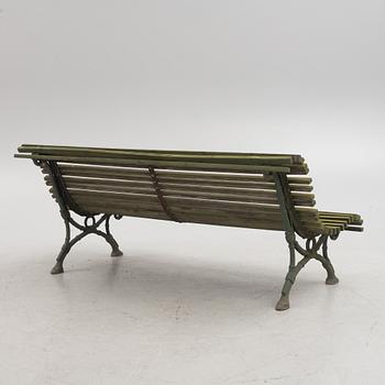 A cast iron-frame garden sofa, circa 1900.