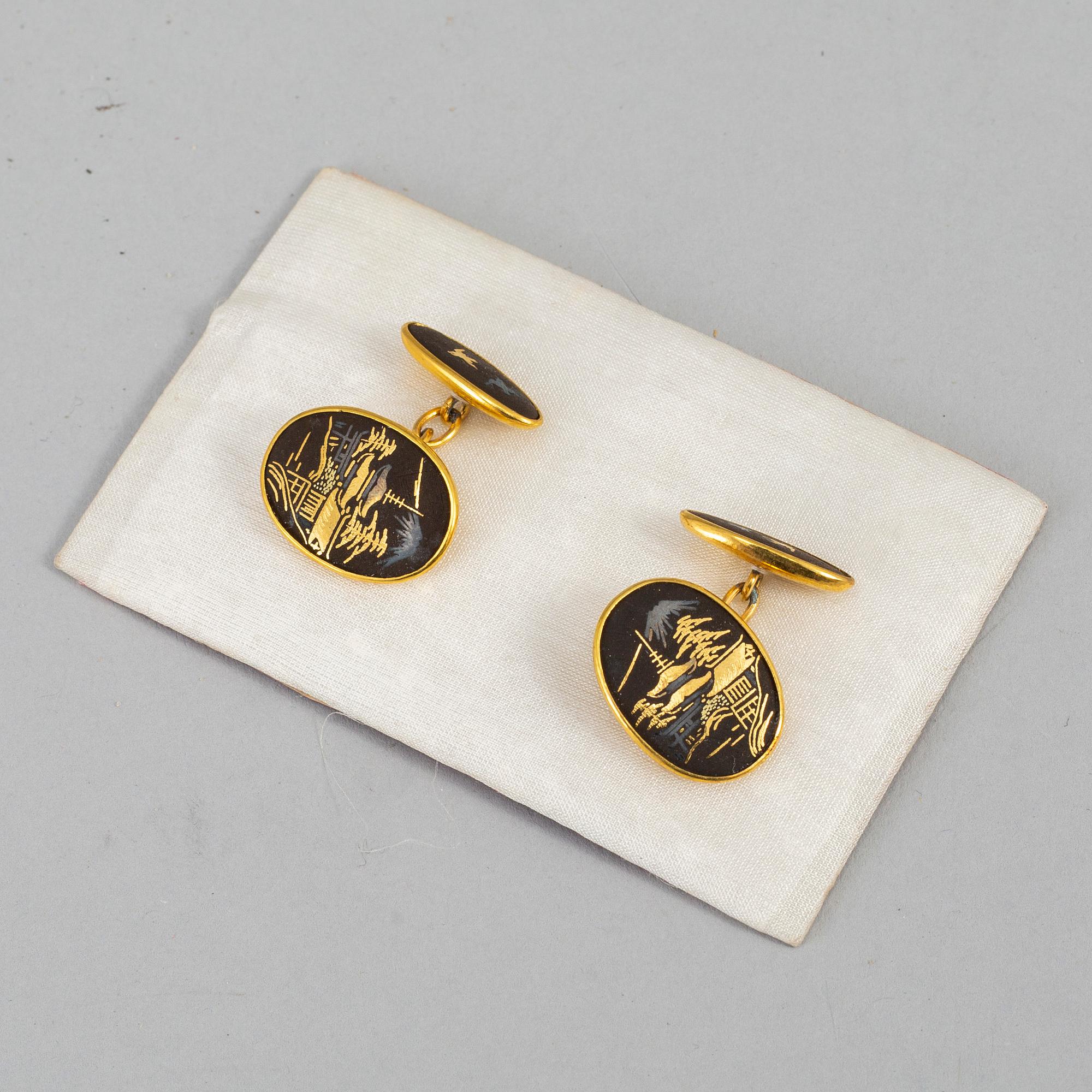 A set of five Japanese metal dishes and a pair of cuff links, 20th Century.