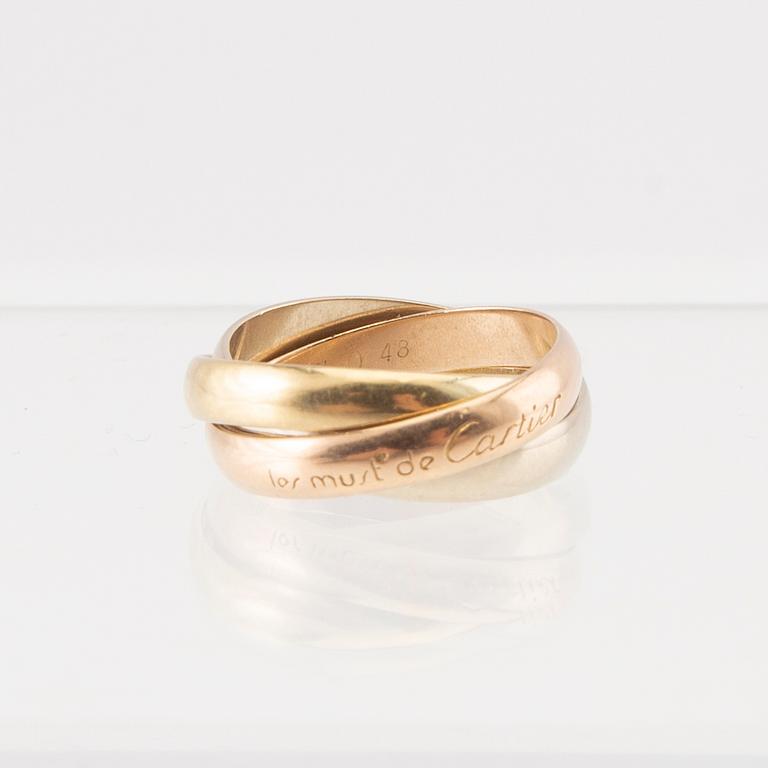 An 18K tri-coloured "Trinity" gold ring by Cartier.