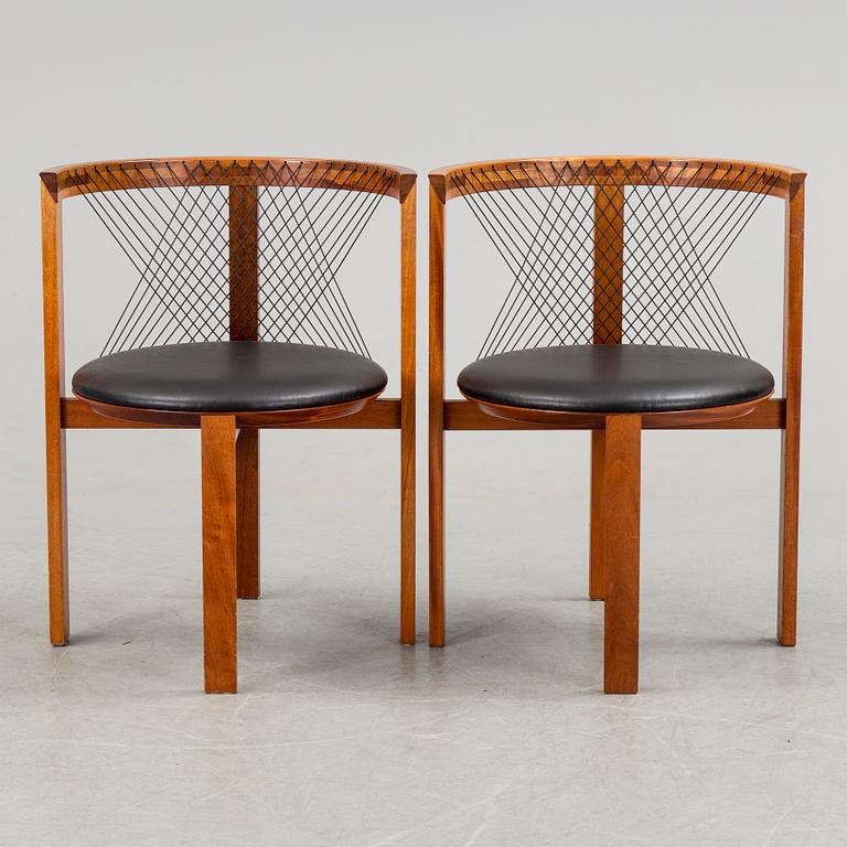 a pair of mahogany armchairs designed by Niels Jörgen Haugesen, made by Tranekaer Furniture, Denmark. 1995.