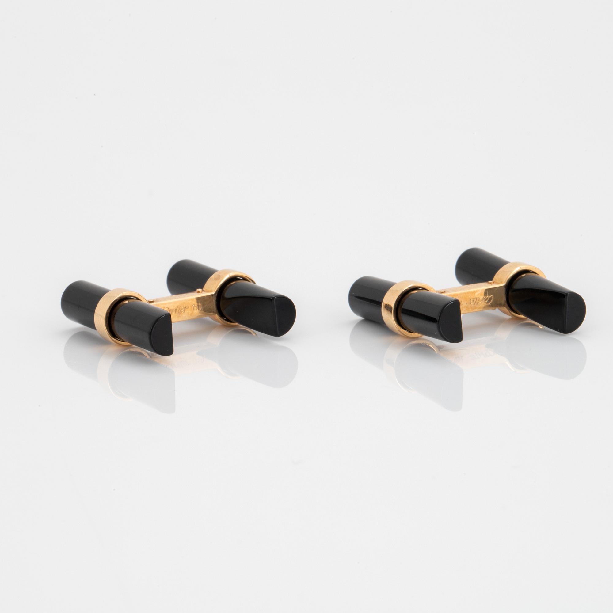 Cartier ett par manschettknappar 18K guld och onyx.