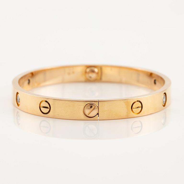 A Cartier "Love" bracelet in 18K rose gold with round brilliant-cut diamonds.
