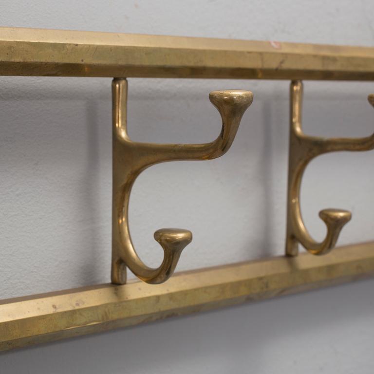 A BRASS COAT HANGER 1920'S.