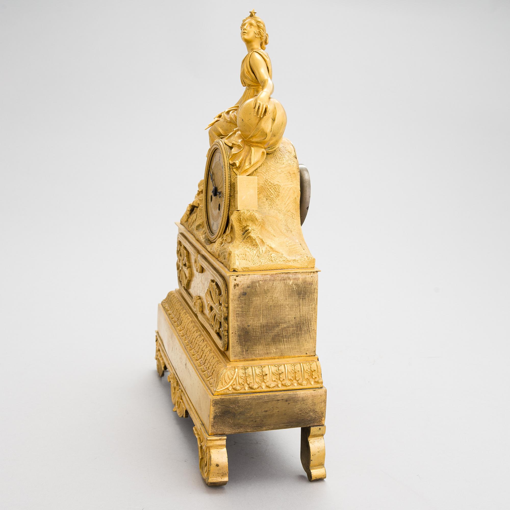 A French Empire mantel clock from 1820s-30s.