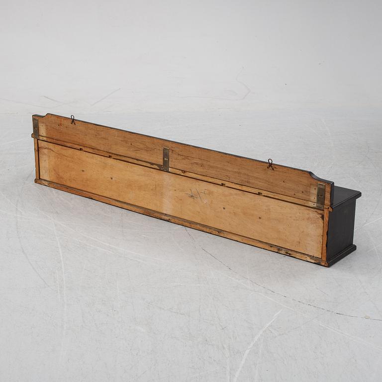 A painted wall shelf, early 20th Century.