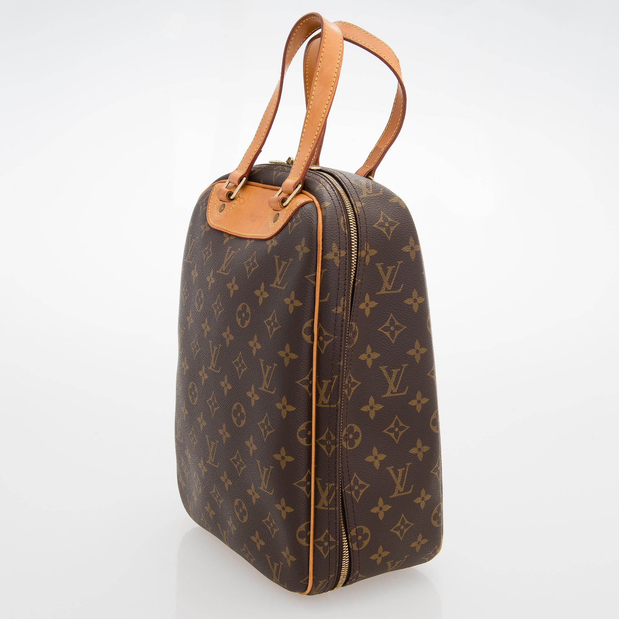 LOUIS VUITTON Monogram Canvas Excursion Bag.