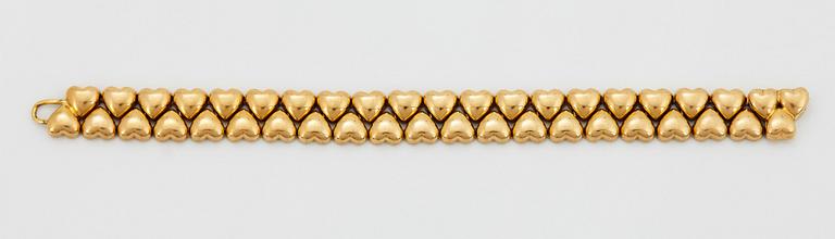 A Cartier 18K gold "Double Hearts" bracelet.