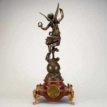 A mantel clock with sculpture "L'occident" after Émile Bruchon from the turn of the century 1800/1900.
