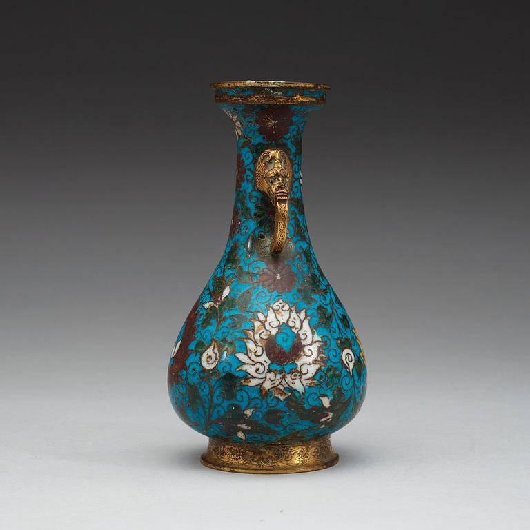 A cloisonné vase decorated with lotus-scrolls, and dragon- shaped gilded handles, Ming Dynasty (1368-1644).