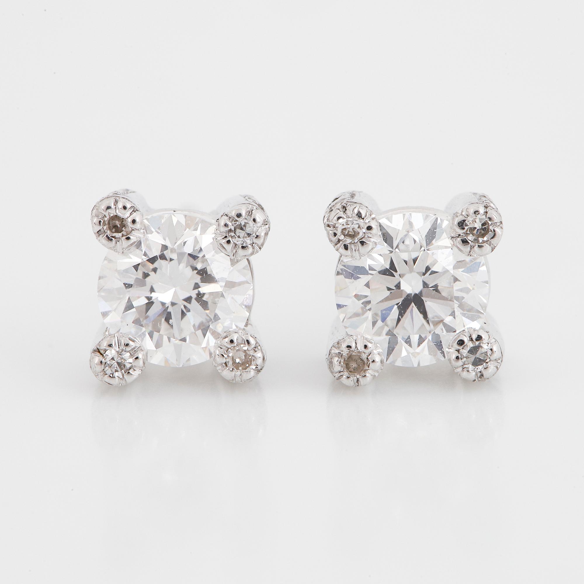 Brilliant-cut diamond stud earrings.