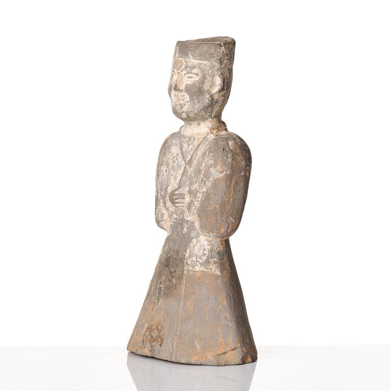 A pottery figure of a standing male figure, Han dynasty (206 BC - 220 AD).