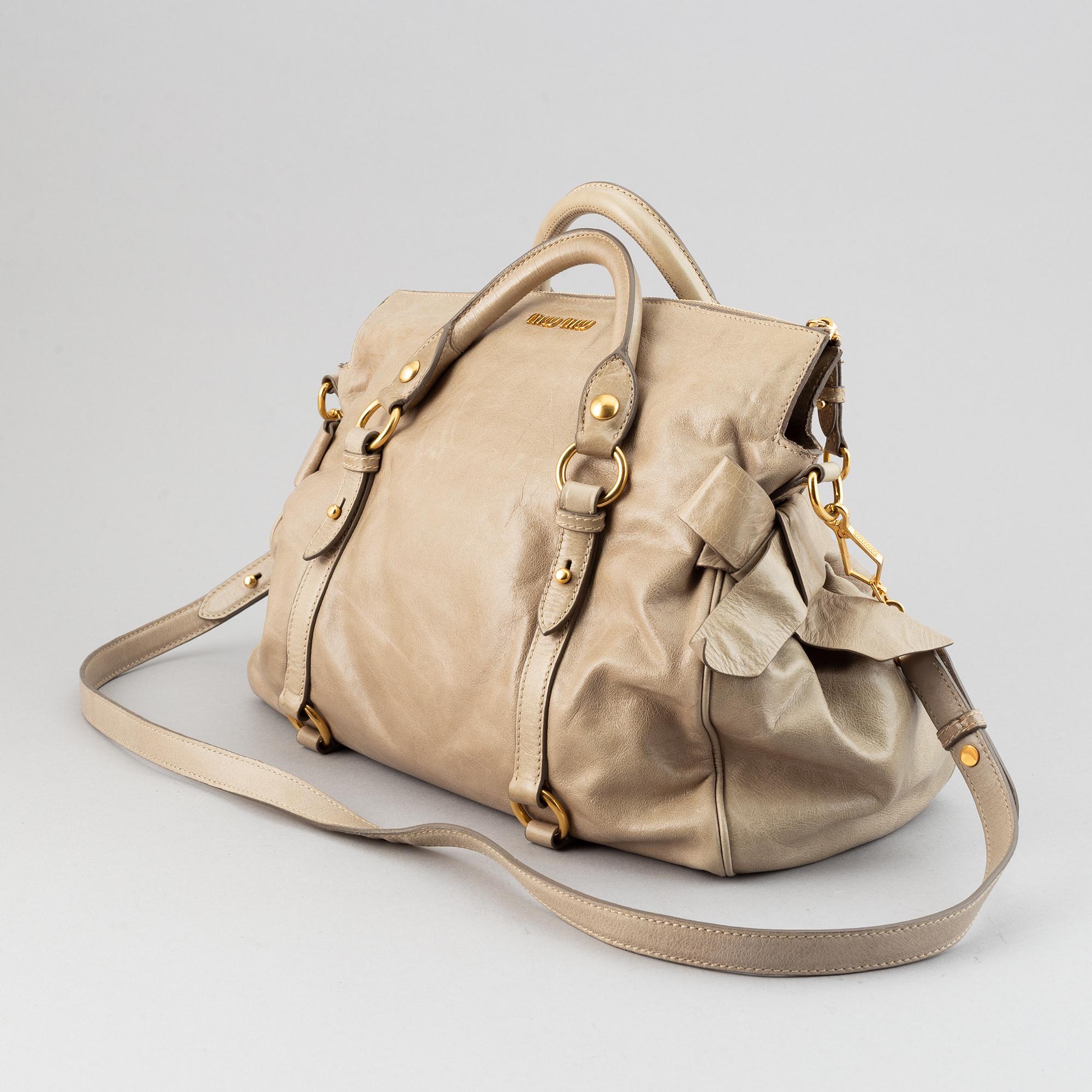 Miu Miu, a leather handbag.