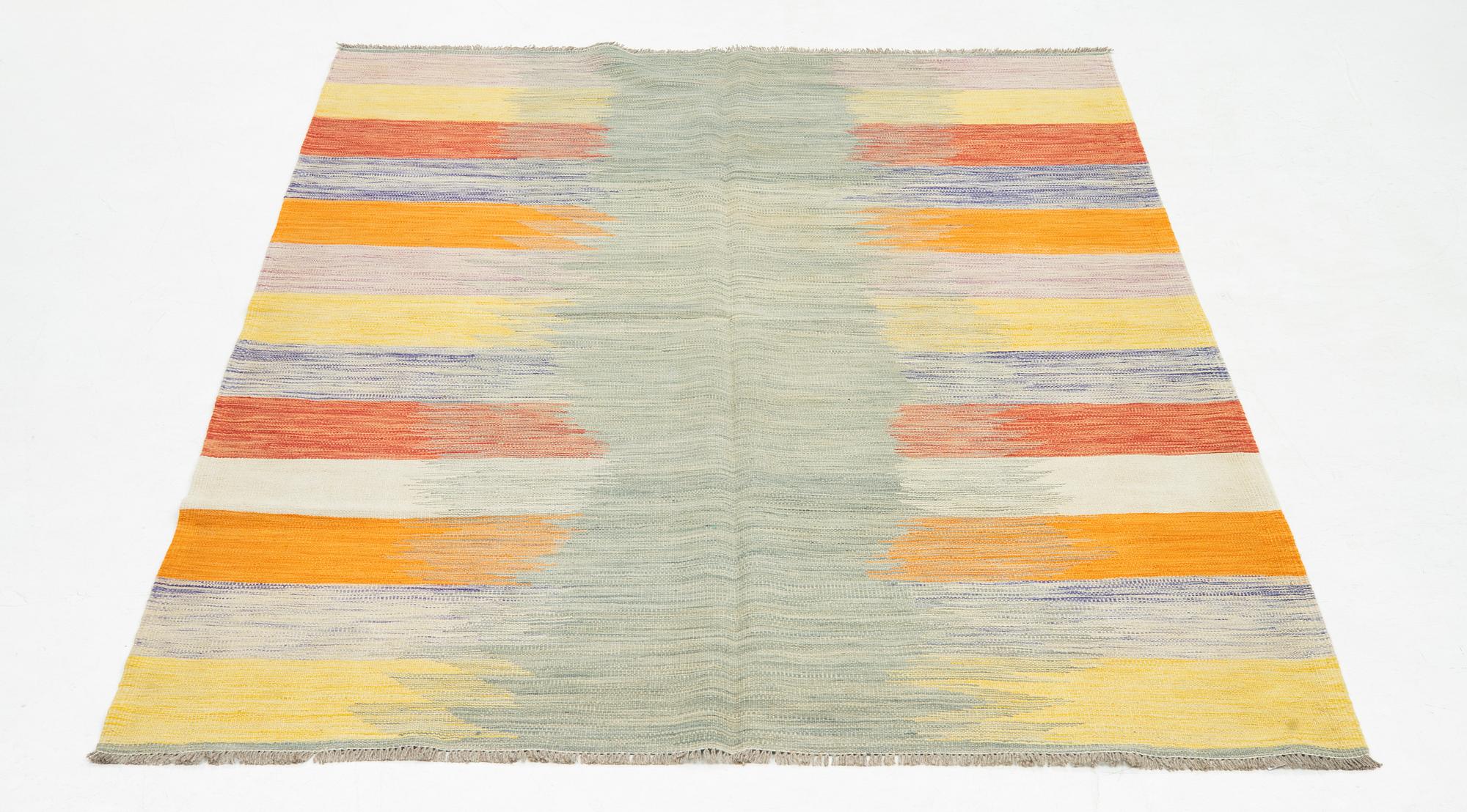 A kilim rug, ca 252 x 175 cm.