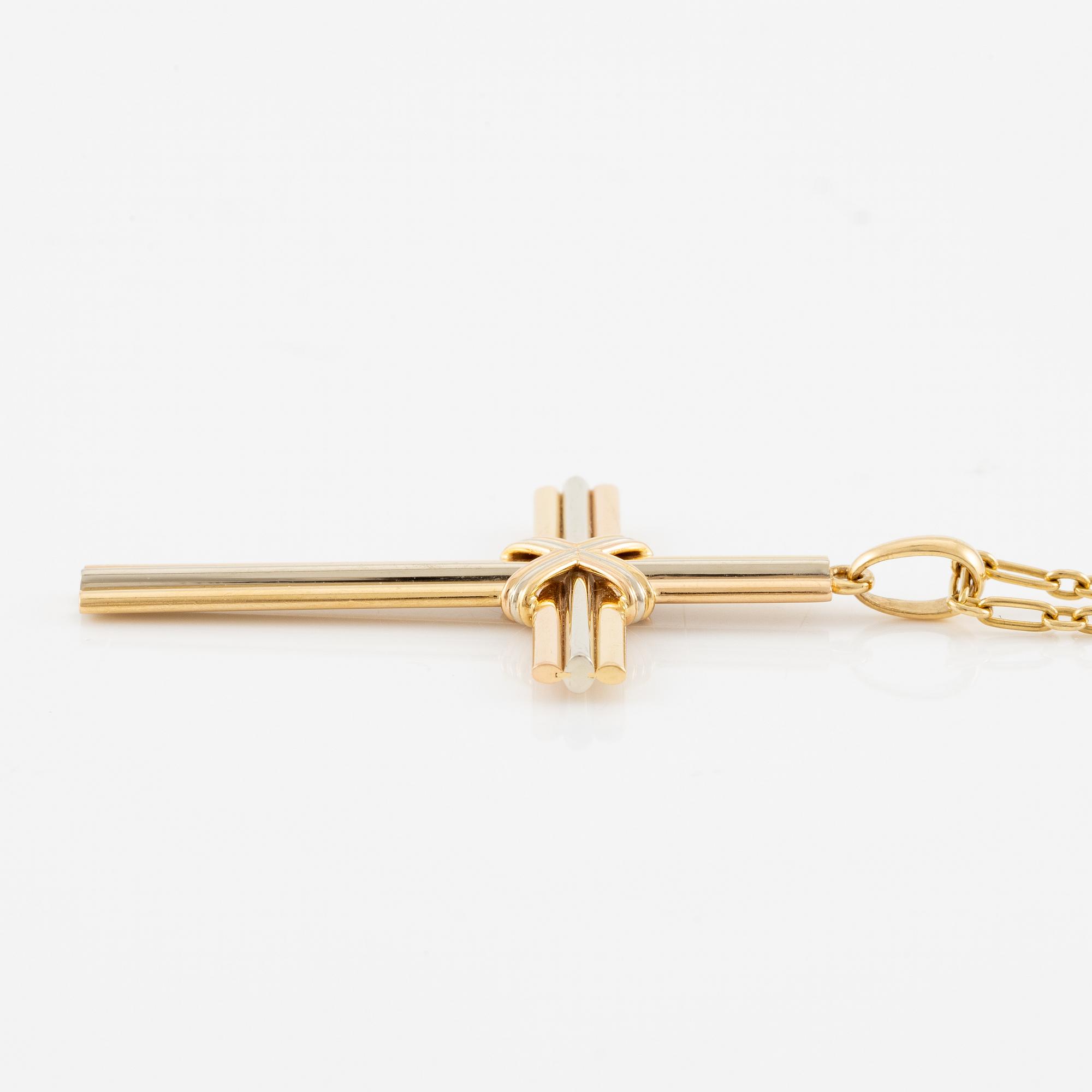 A Cartier necklace 18K multi-coloured gold "Trinity" cross.