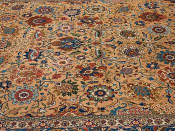 A carpet, semi-antique Tabriz, ca 404 x 292 cm.