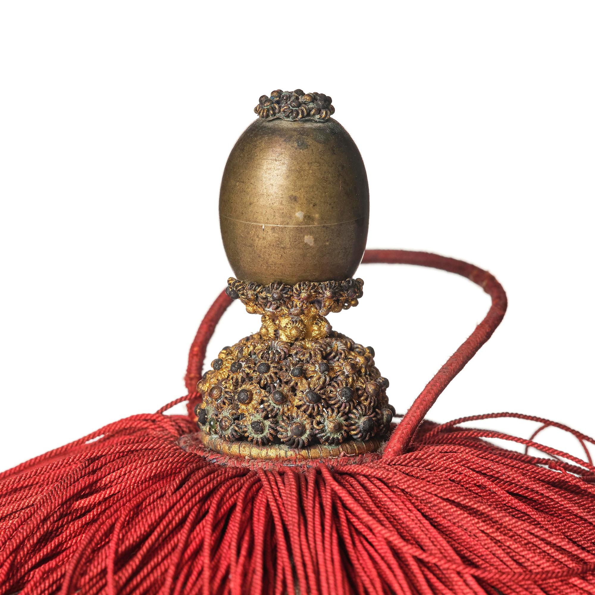 Two boxes with a mandarin's summer hat and black satin autumn hat and feather with six mandarin hat insignias.