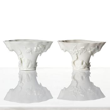 A pair of blanc de chine rhinoceros libation cups, Qing dynasty, Kangxi (1662-1722).