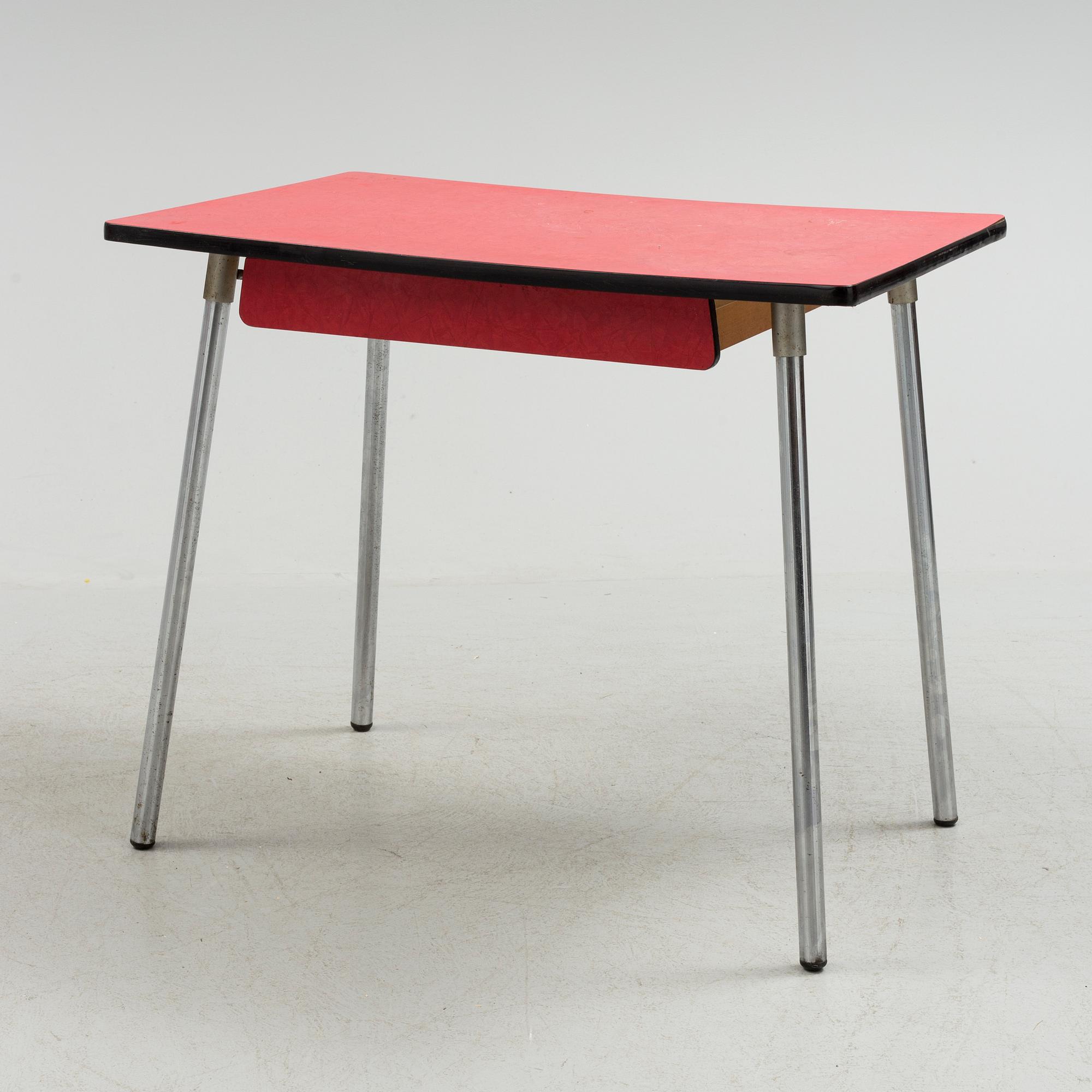 A mid 20th century table and chair.