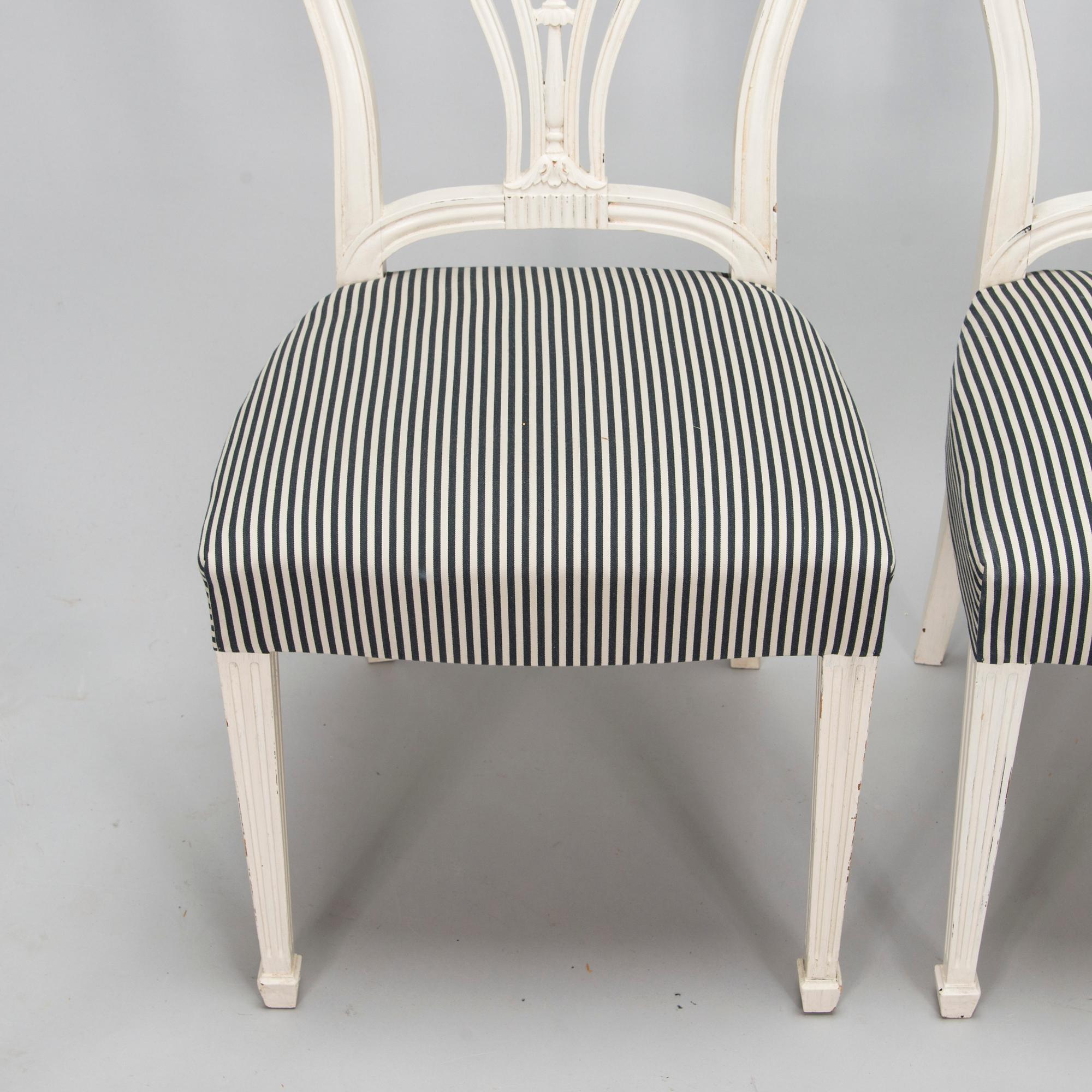 Four George III style chairs, early 20th century.