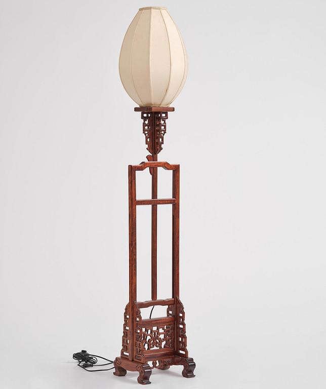 A Chinese wooden floor lamp, later part of the 20th century.