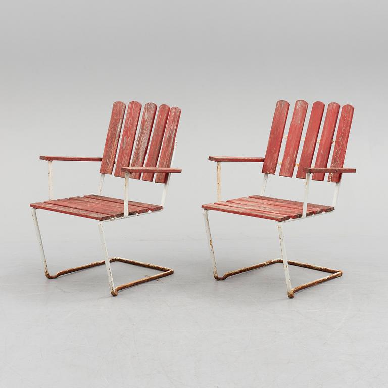 A pair of mid 20th century garden armchairs by Grythyttan stålmöbler.