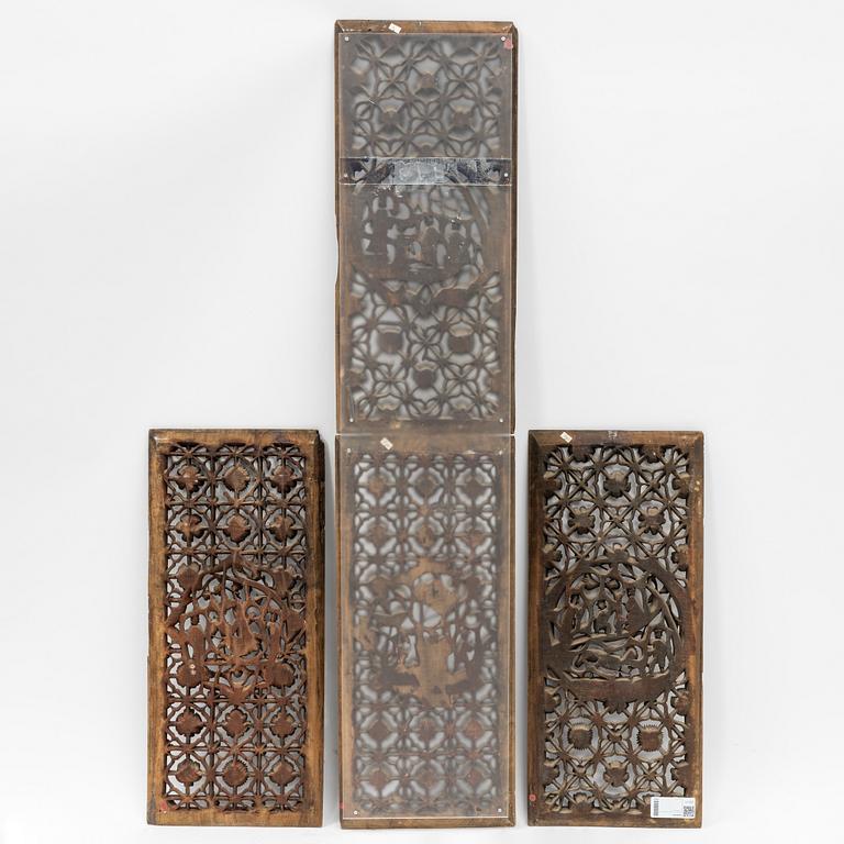 Four carved panels, China, 20th century.