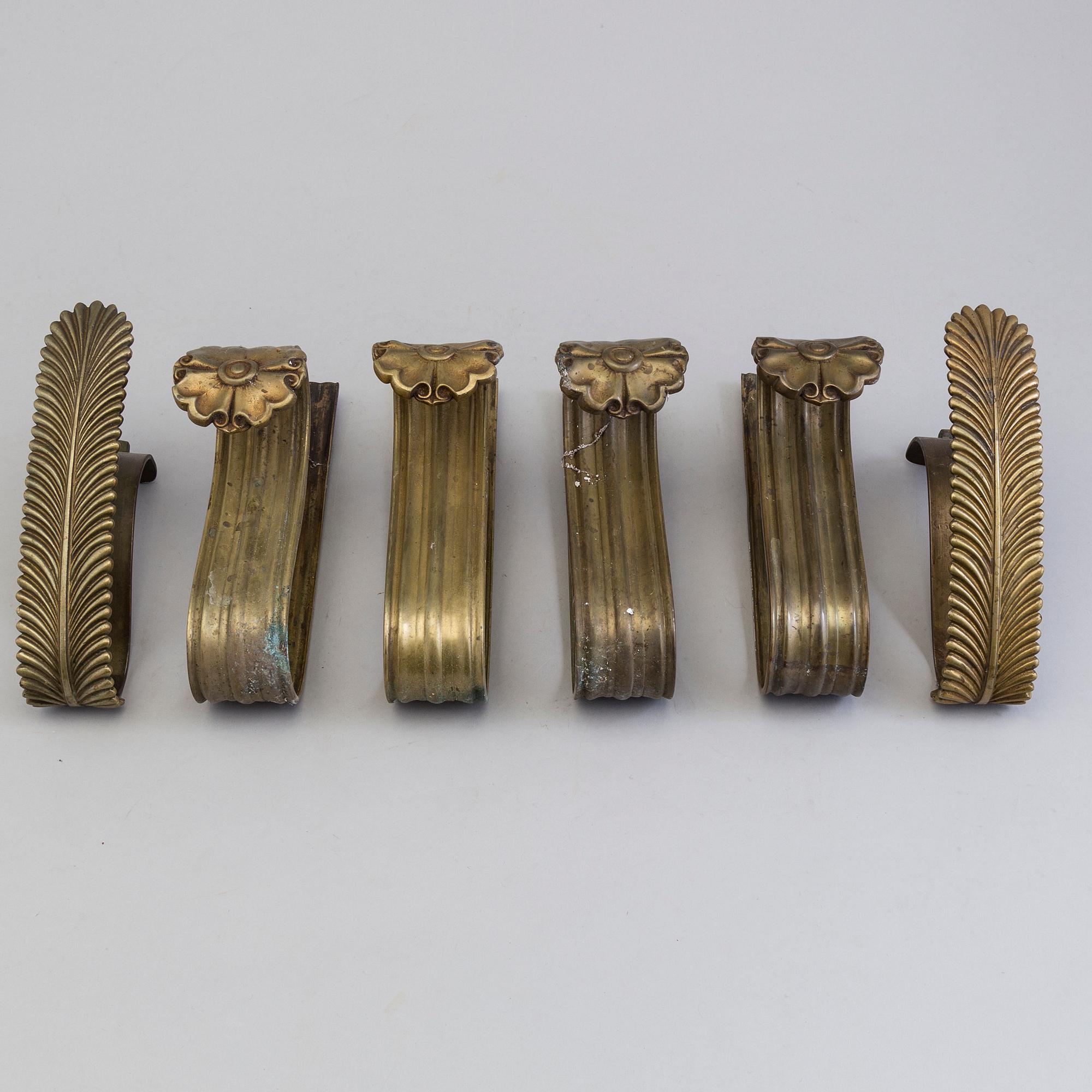 SIX BRONZE CURTAIN TIE-BACKS (4+2), 19th century.