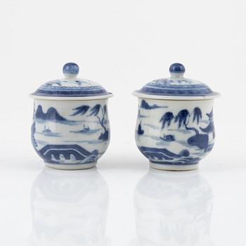 A blue and white terrine with cover and stand, Qianlong (1736-95) and two blue and white custard cups, 19th century.