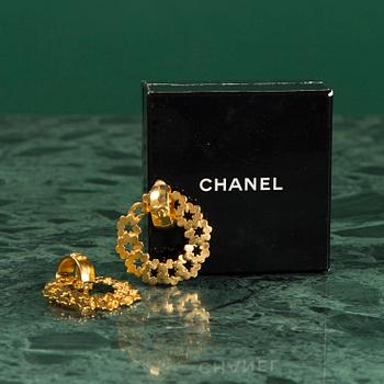 A pair of earrings by CHANEL.